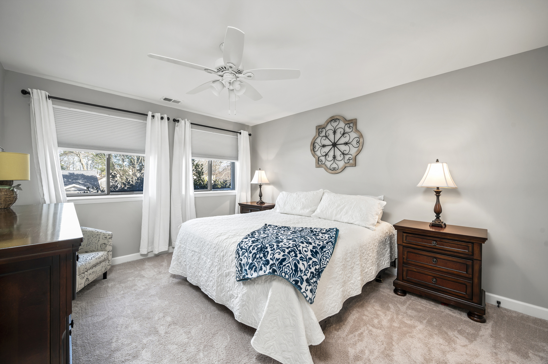 Primary Bedroom adorned in Nautical Navy and Crisp White.