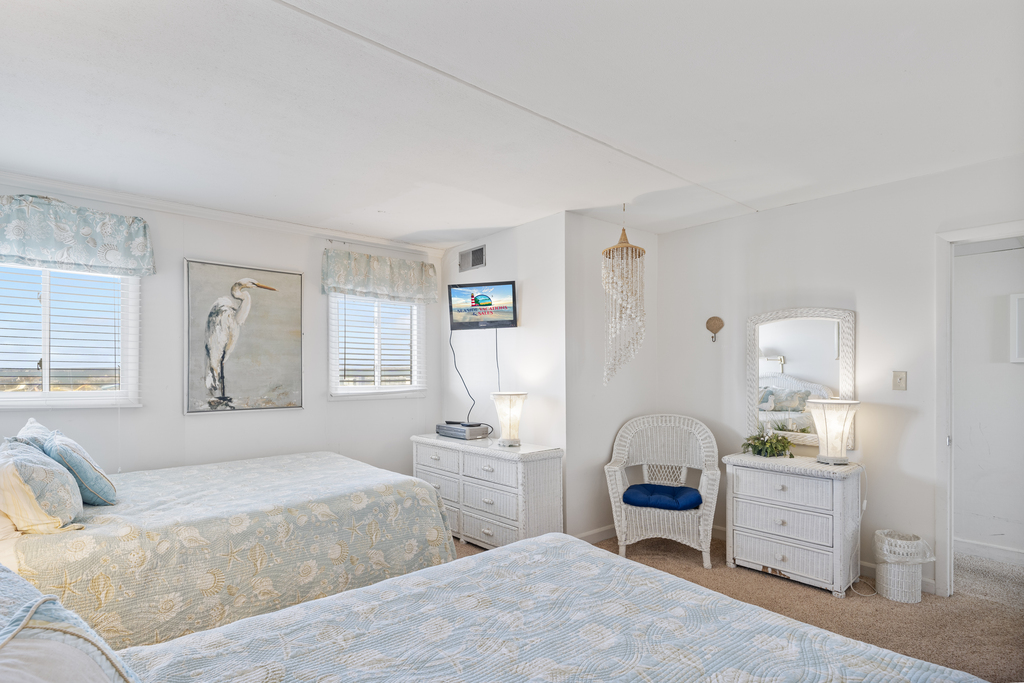 Sink into bed and catch up on your favorite shows on the Flat Screen TV!