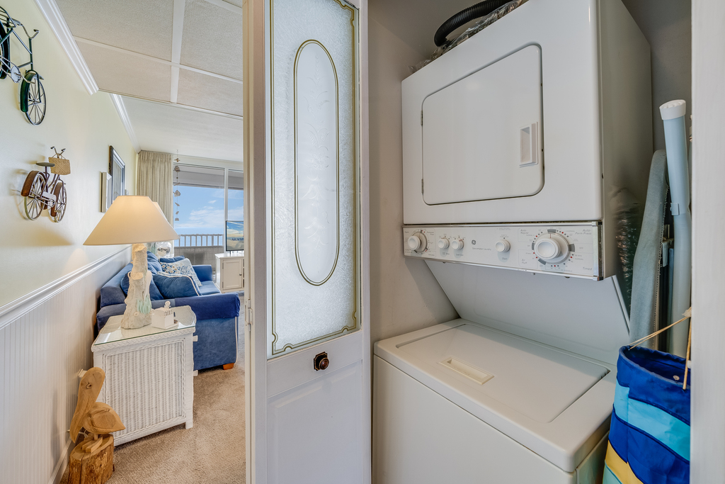 A stacked washer-dryer is available for your use within the home.