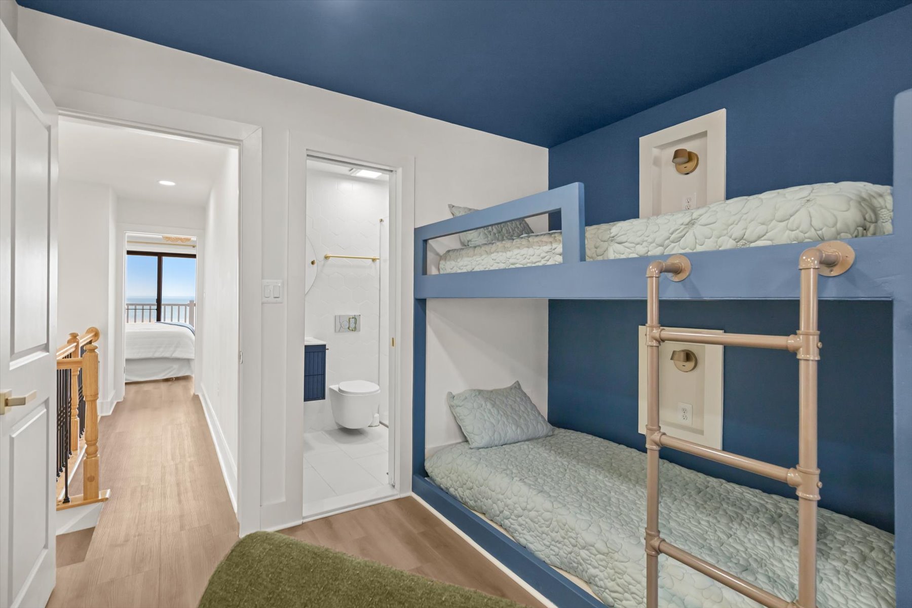 This bedroom features a private bath.