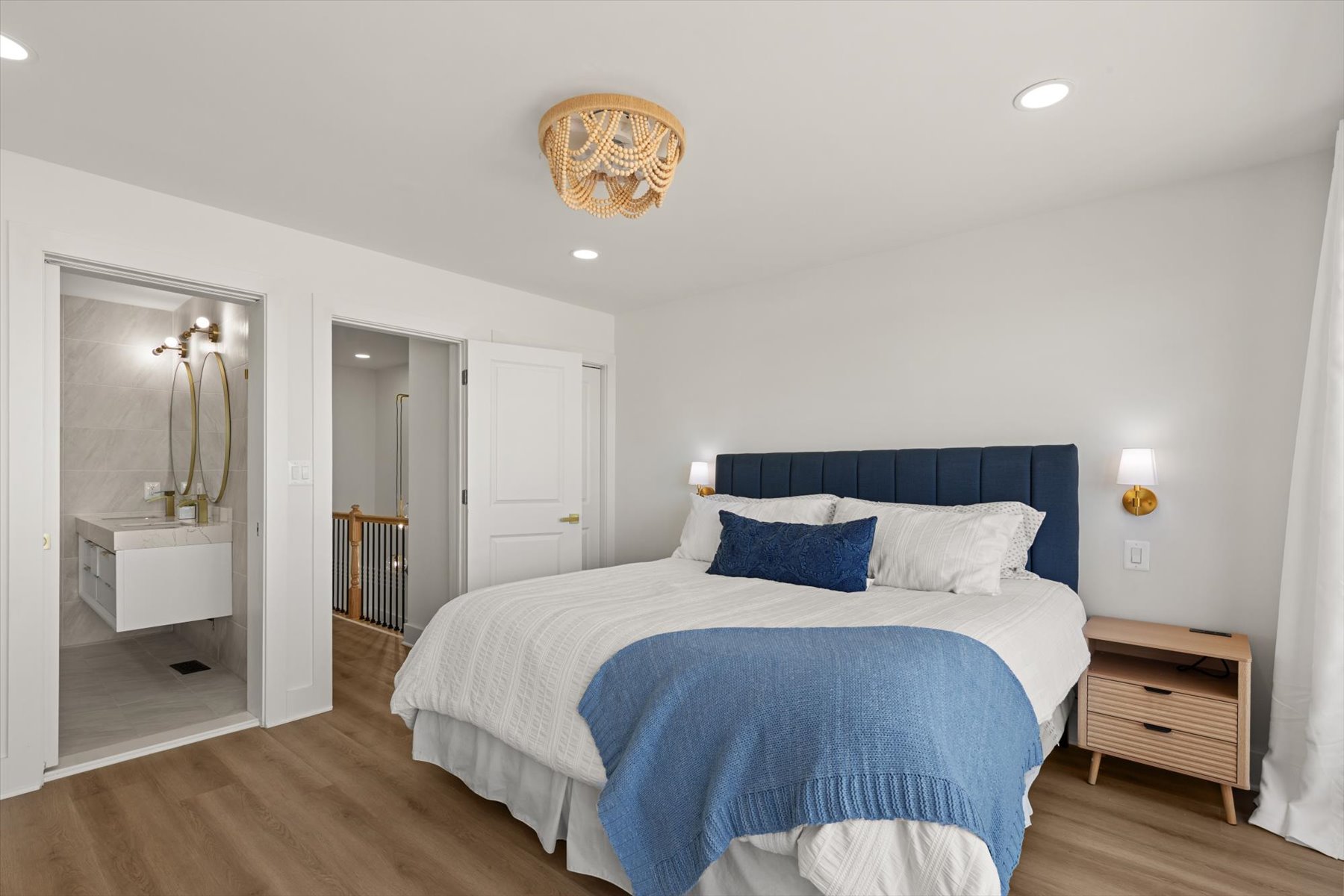 Serene and coastal bedroom with a King bed.