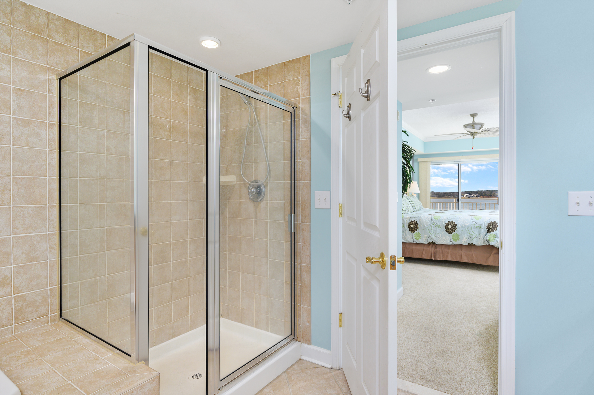 Wash away the day and prep for the evening in the custom tile, walk-in Shower.
