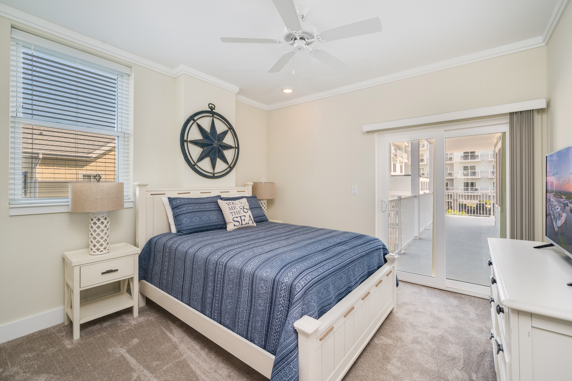 Bedroom 3 has a cozy Queen Bed, a Flat Screen TV and Balcony access!