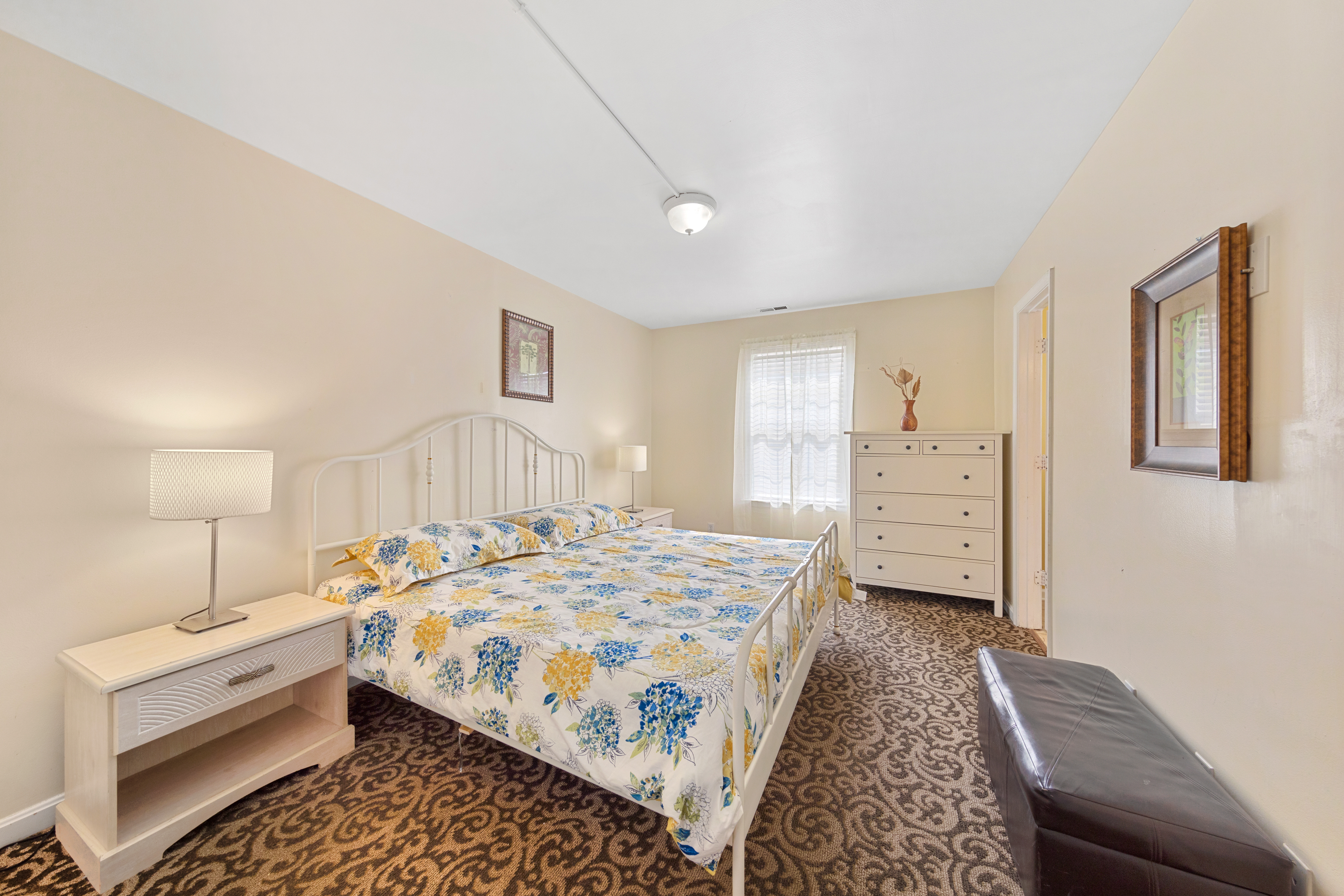 The Primary Bedroom features a cozy king size bed.