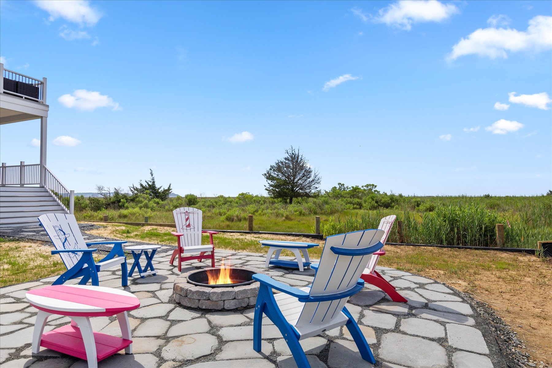 Sink into the fun Adirondacks and take in a Chincoteague Sunset.