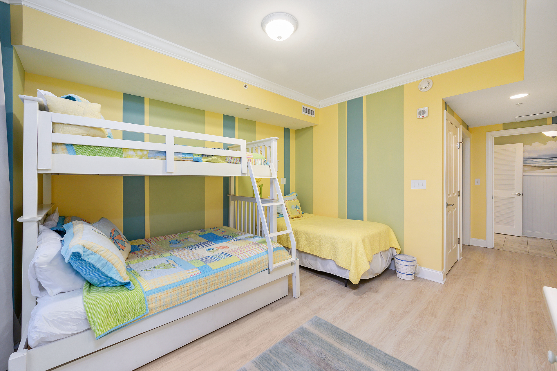 There is a Pyramid Bed with Full size under and twin size above. There is also an extra Twin bed, perfect for bunking up!