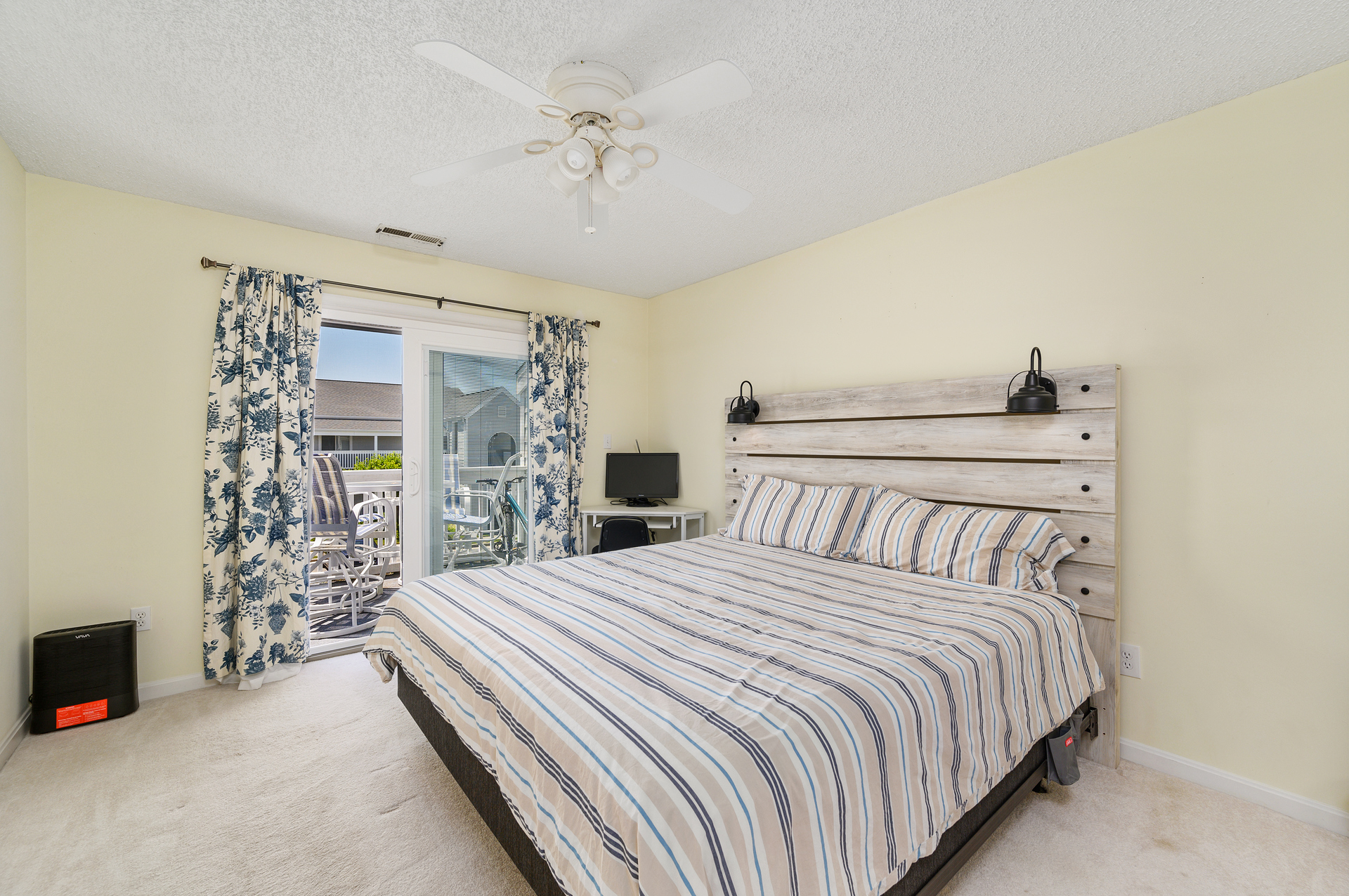 This Primary Bedroom offers a Plush King bed