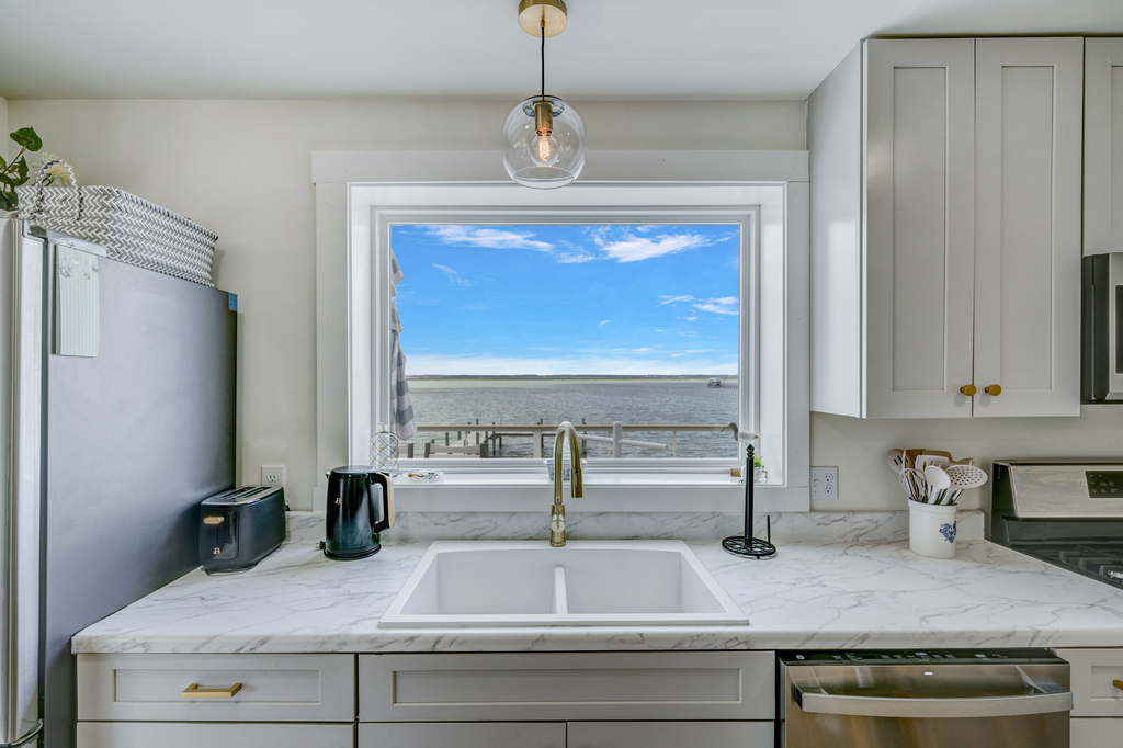 Beachy Cabinetry and Quartz Countertops.