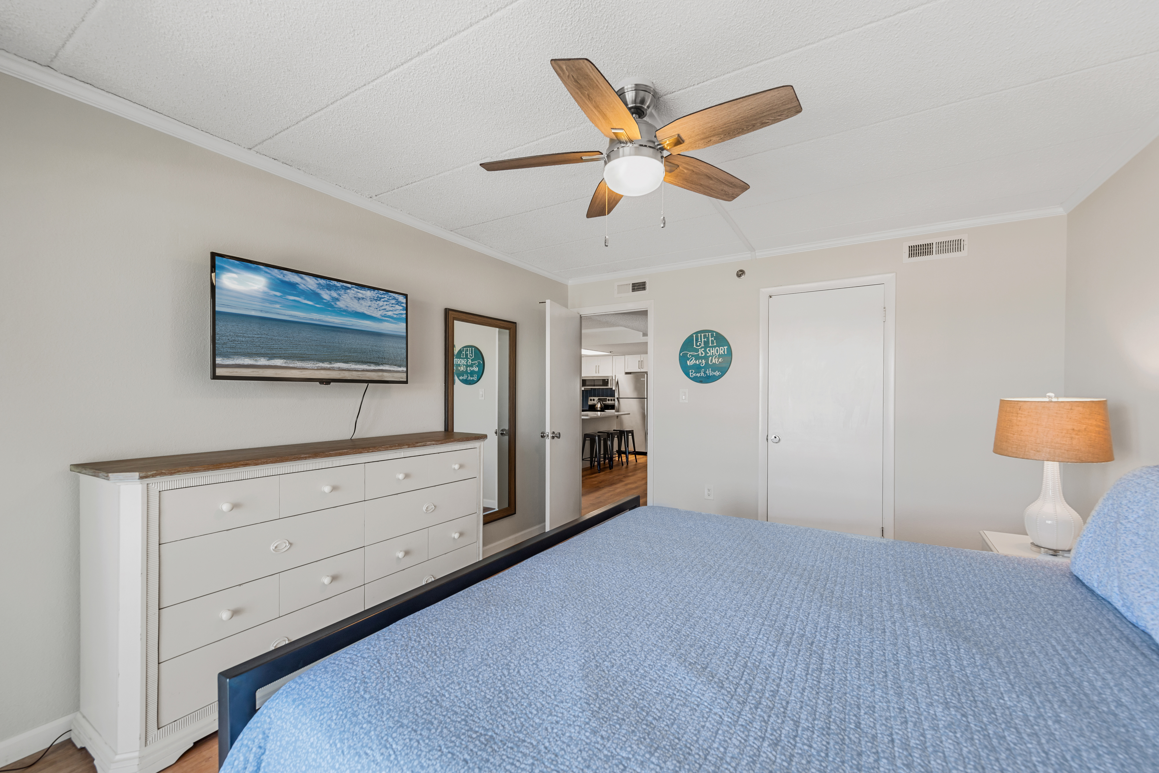 The Primary Bedroom features Private Balcony Access and a Flat Screen TV.