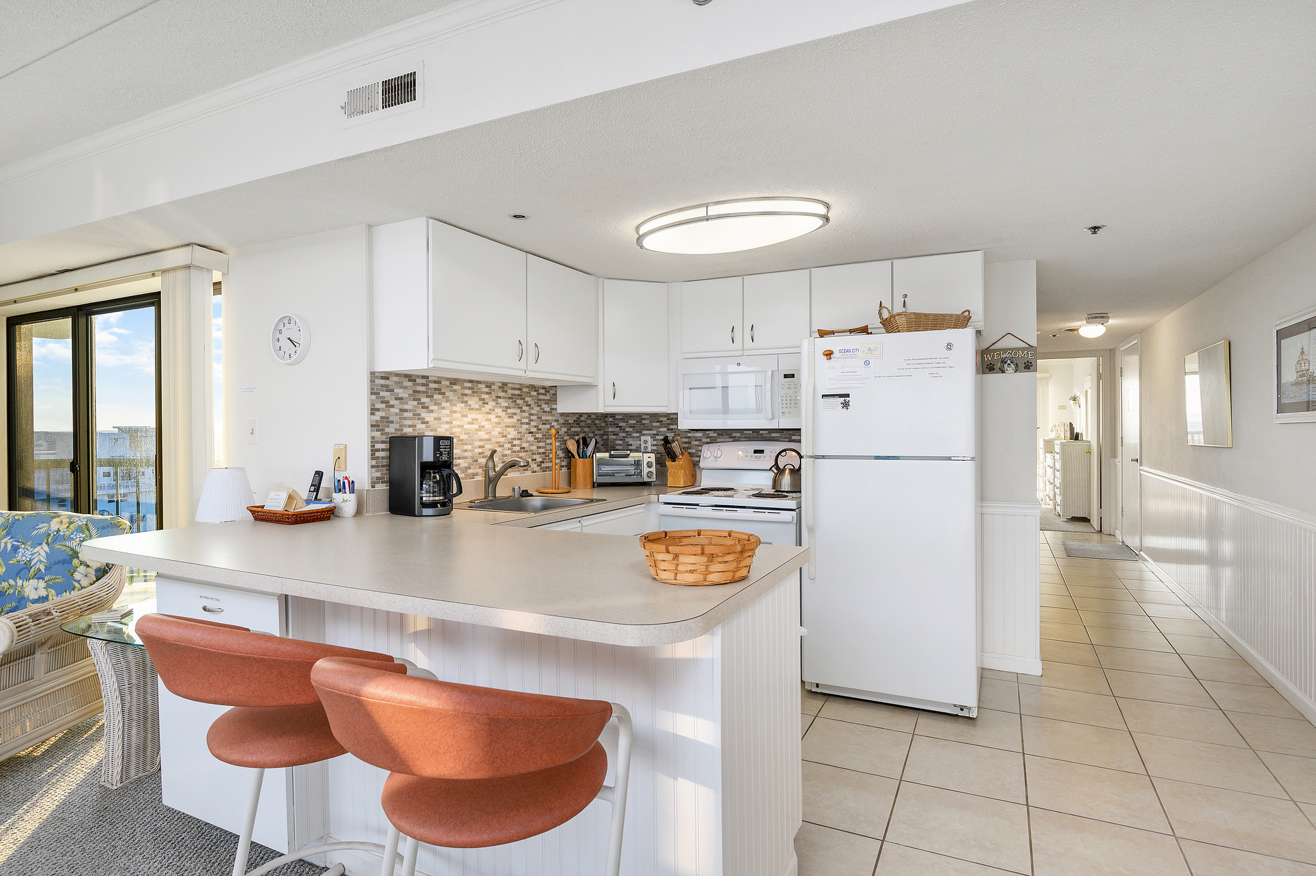 Sit at the Breakfast bar and keep the cook company!