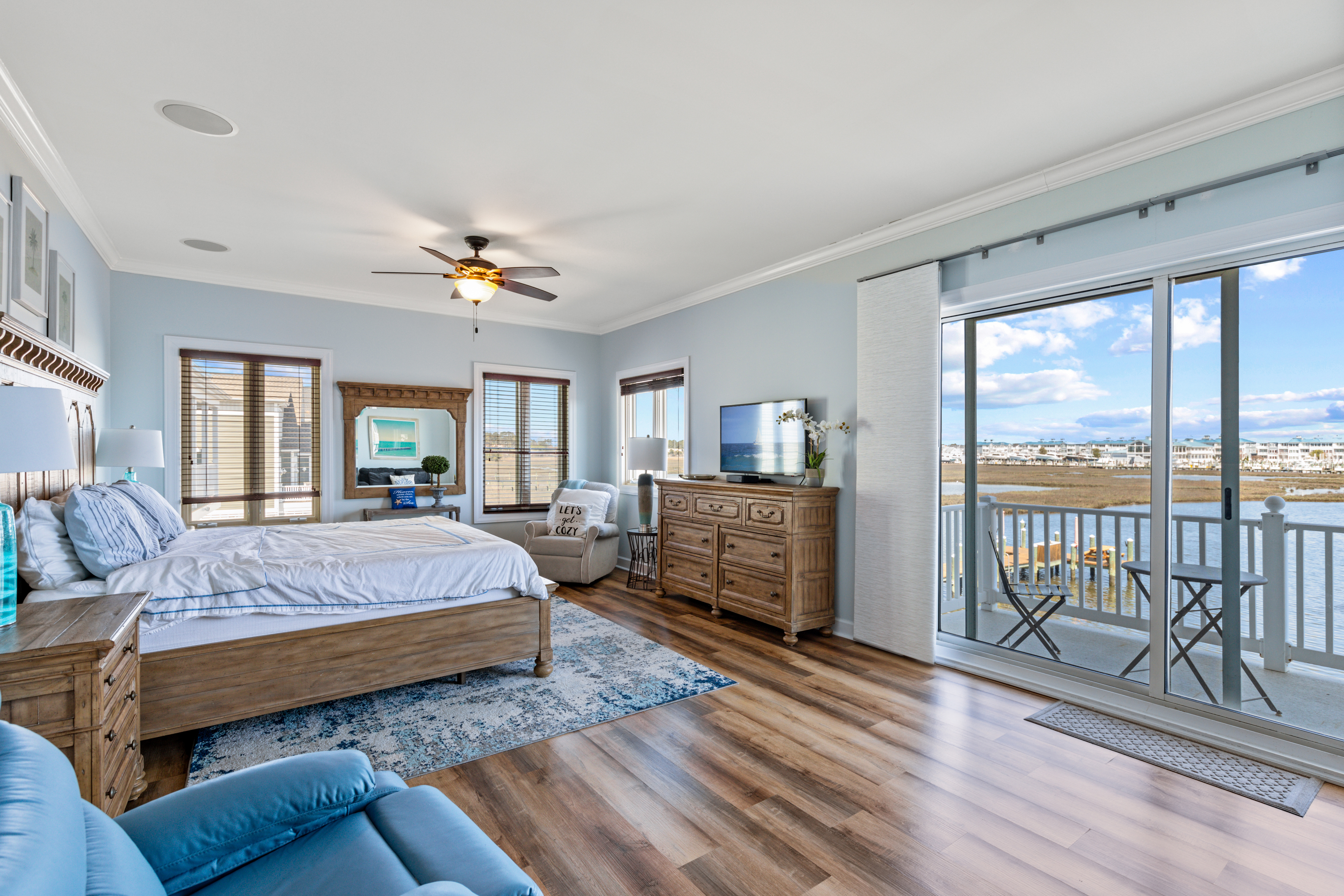 The beautiful Primary Bedroom has breathtaking Bay Views and a Private Balcony.