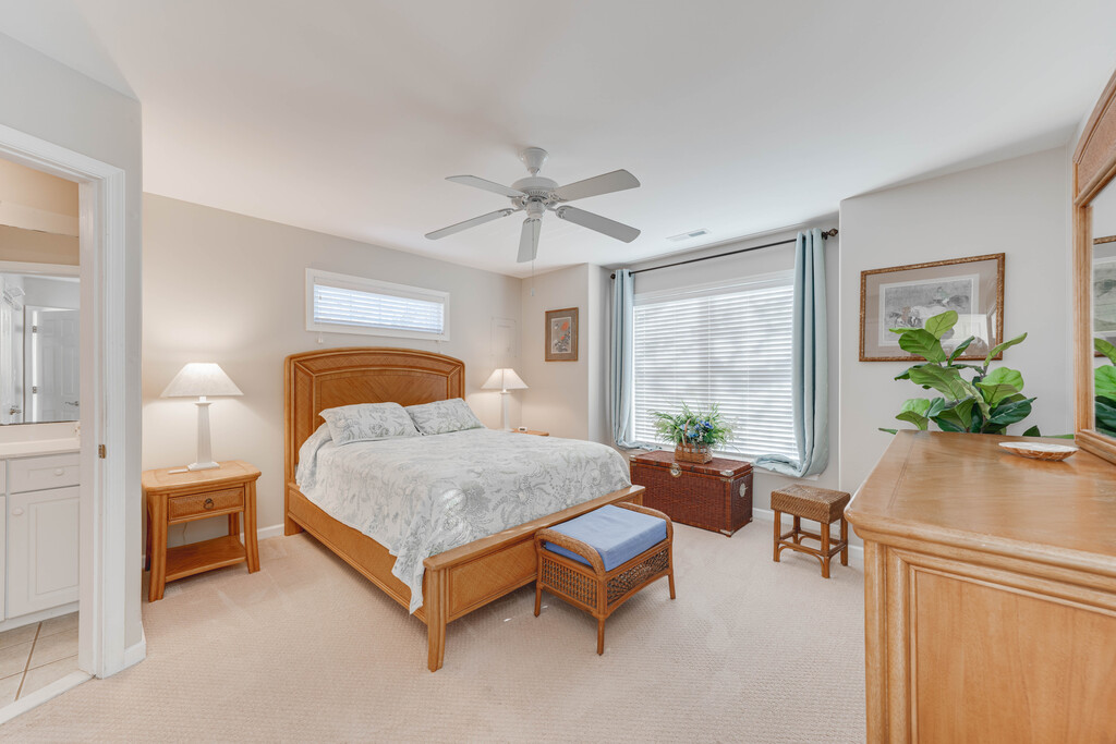 Huge Primary Bedroom with comfy Queen Bed and warm wood furnishings.