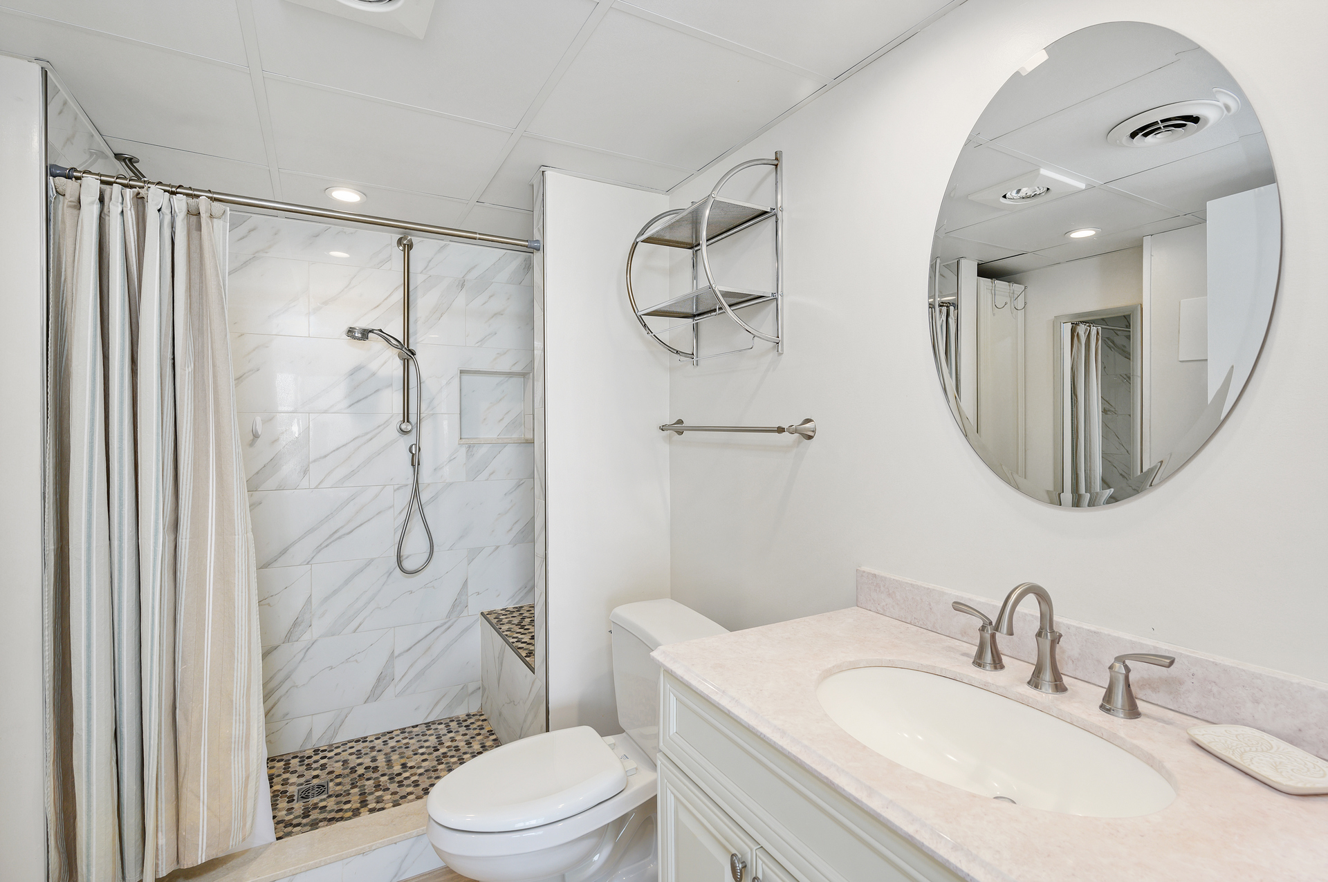 The Primary Bath has a beautiful custom walk in shower