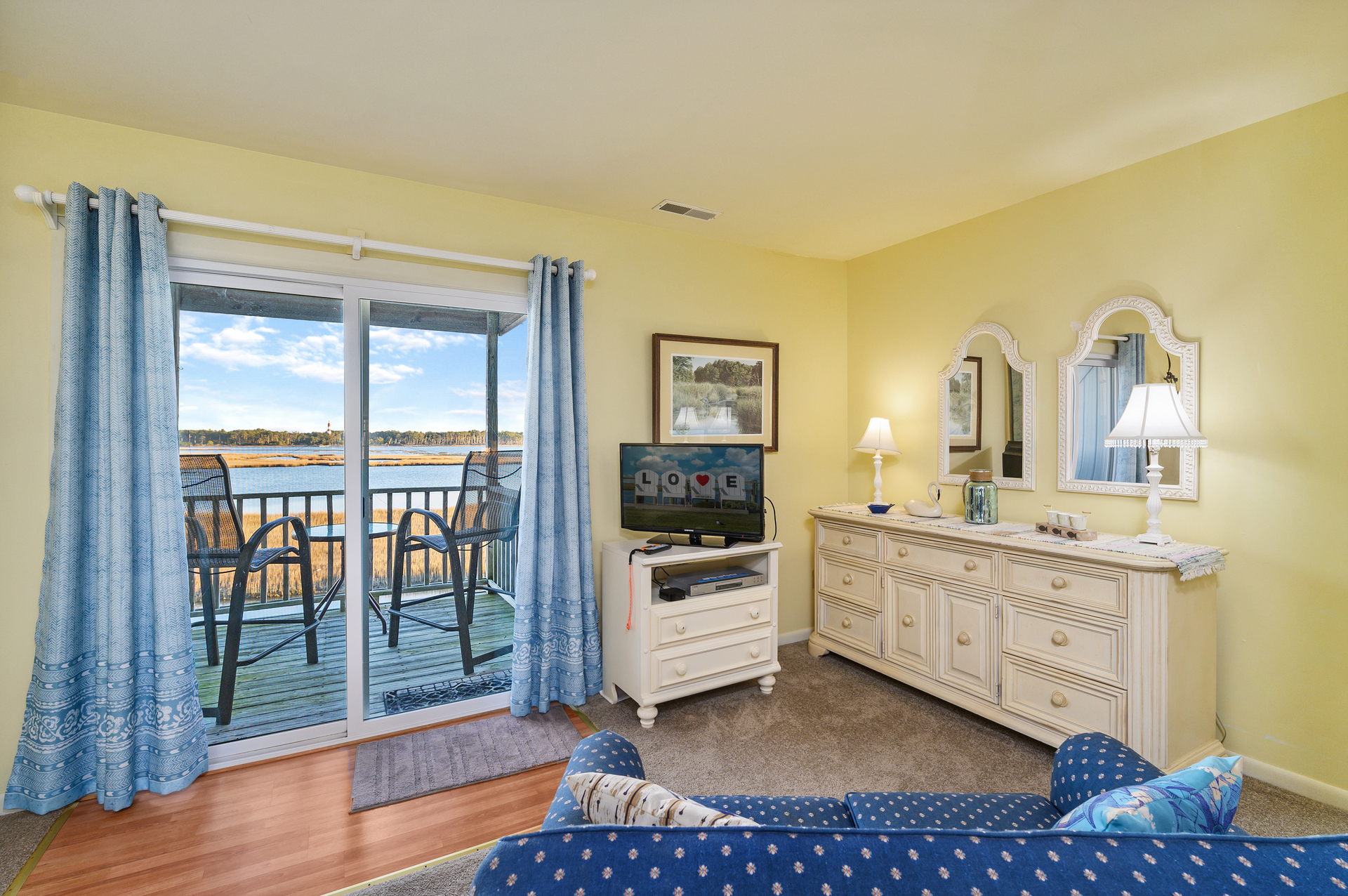 Flat Screen TV and Private Balcony in Bedroom 3.