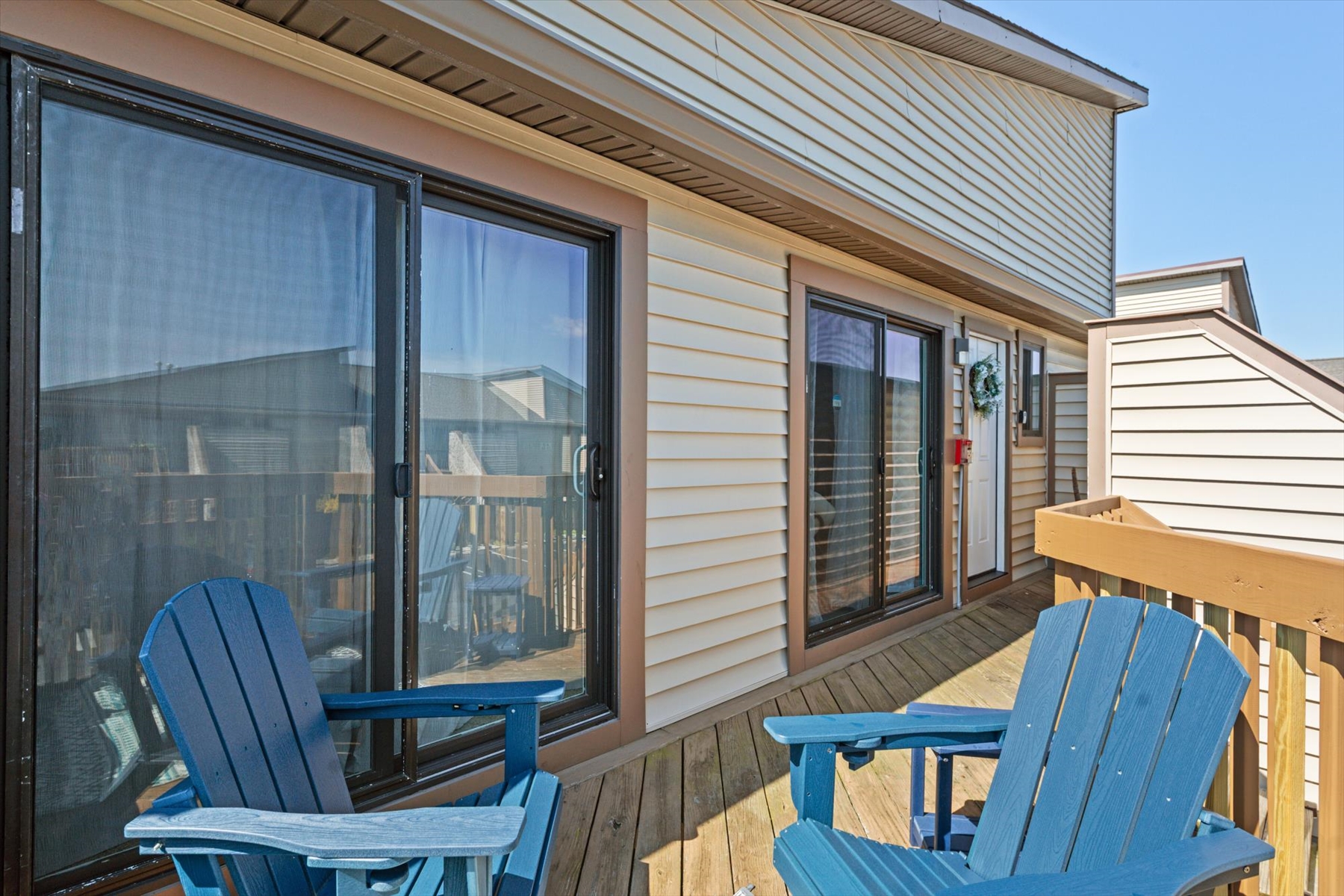 Step outside onto the sunny deck to enjoy a refreshing breeze right outside your sliding glass doors.
