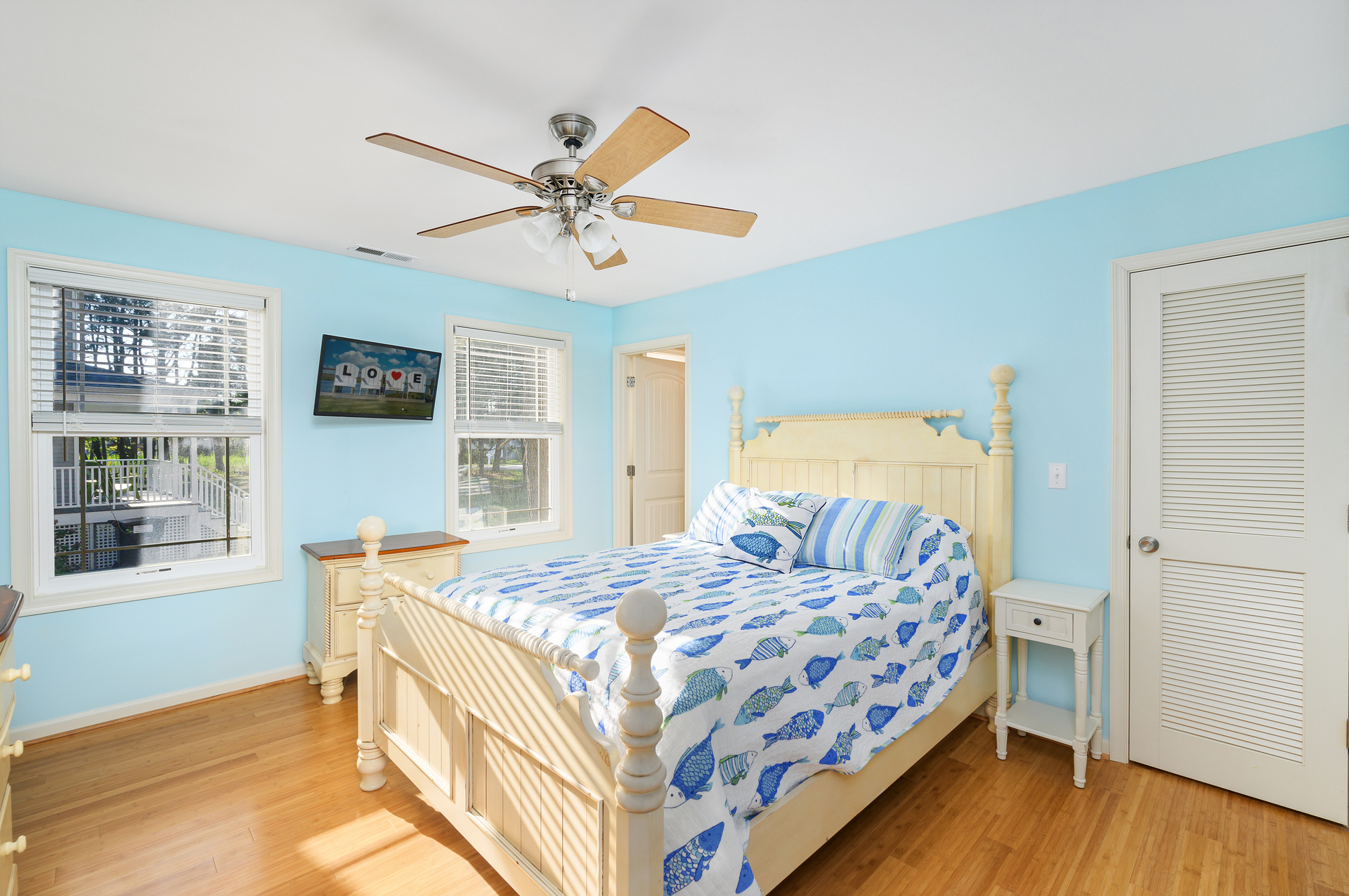 1st Floor Master Bedroom is dressed in Beachy Blues and Crisp Whites.