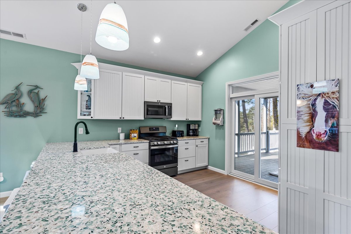 Gleaming Granite Countertops and Stainless Appliances.