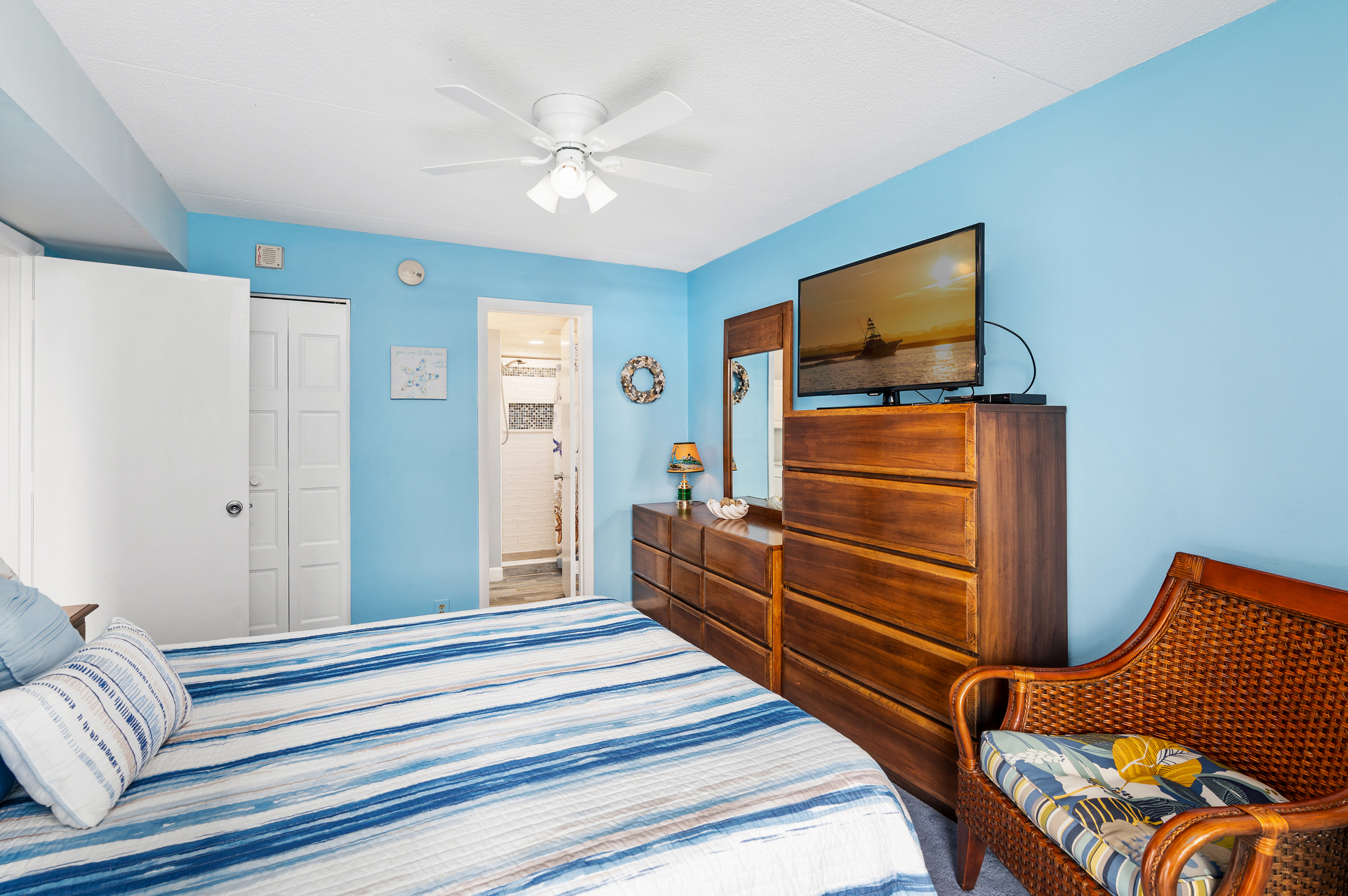 The Primary Bedroom is the perfect place to relax after a long day at the beach.