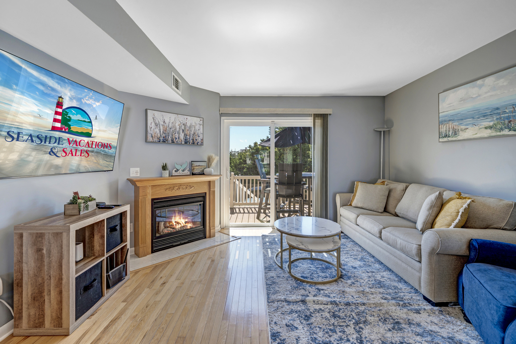The open Living Area on the second level is warm and welcoming with a decorative Fireplace.