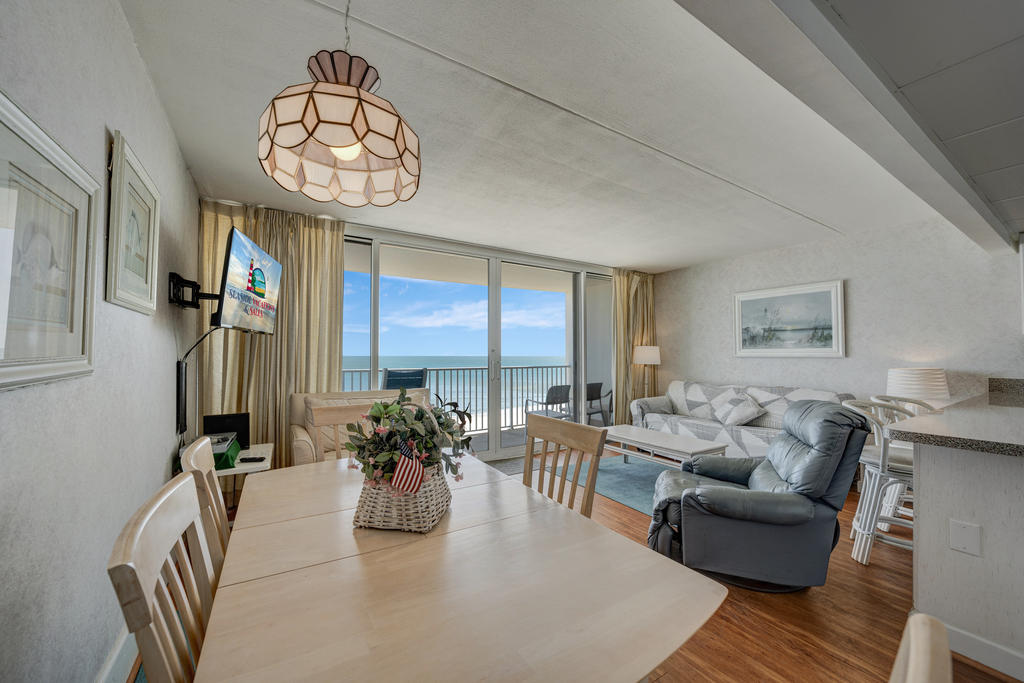 Enjoy the Sunrise from a comfy chair or glide outside to breathe in the Salty Air!