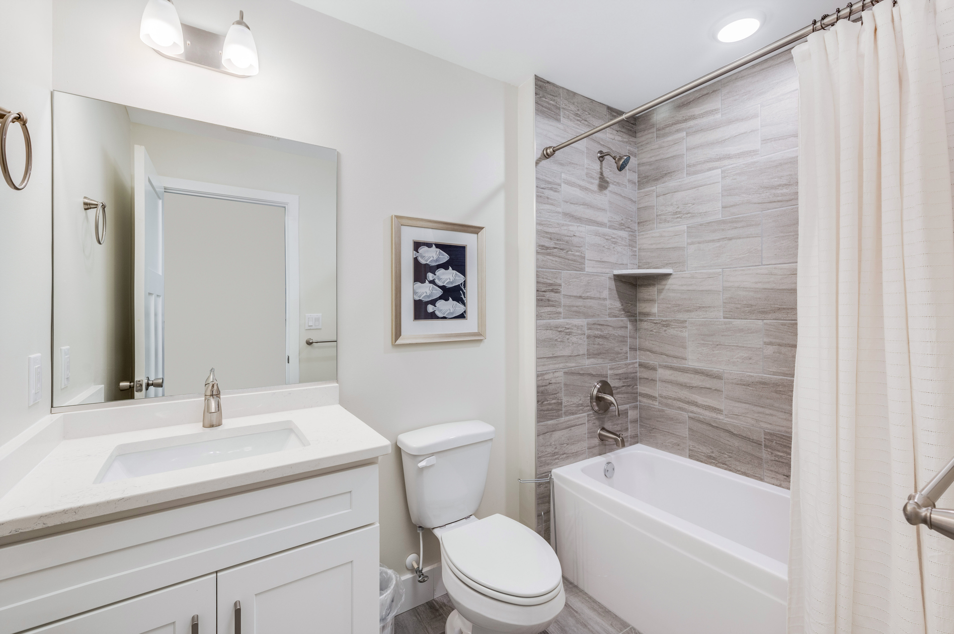 The Shared Full bath offers a beautiful, custom tile Shower/Tub Combo