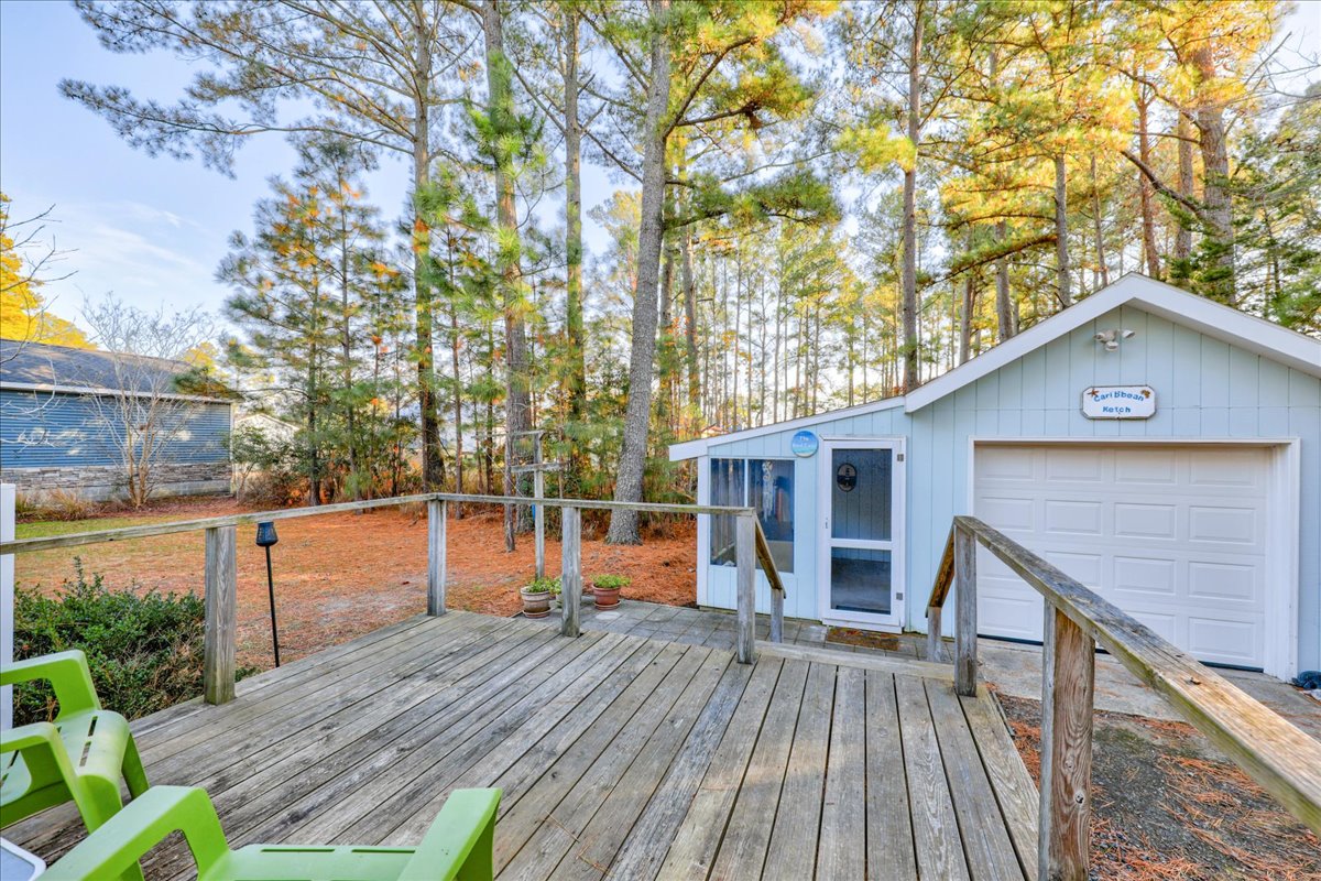 Just off the Deck is a detached Garage and Screened Room.