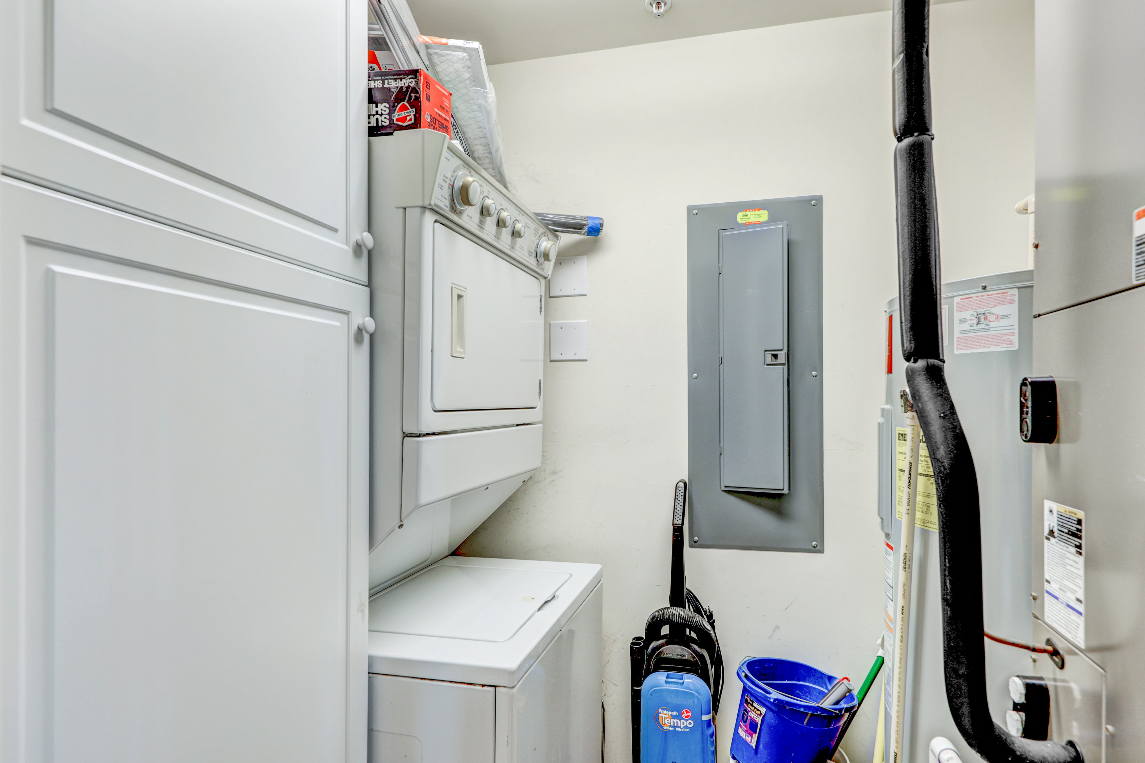 stackable washer and dyer conveniently located in the utility area.