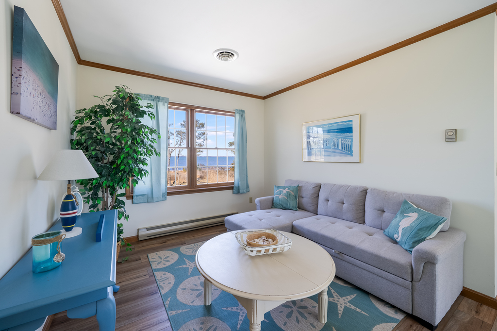 Wandering upstairs, you'll find a cozy Sitting Area with a Sleeper Sofa.
