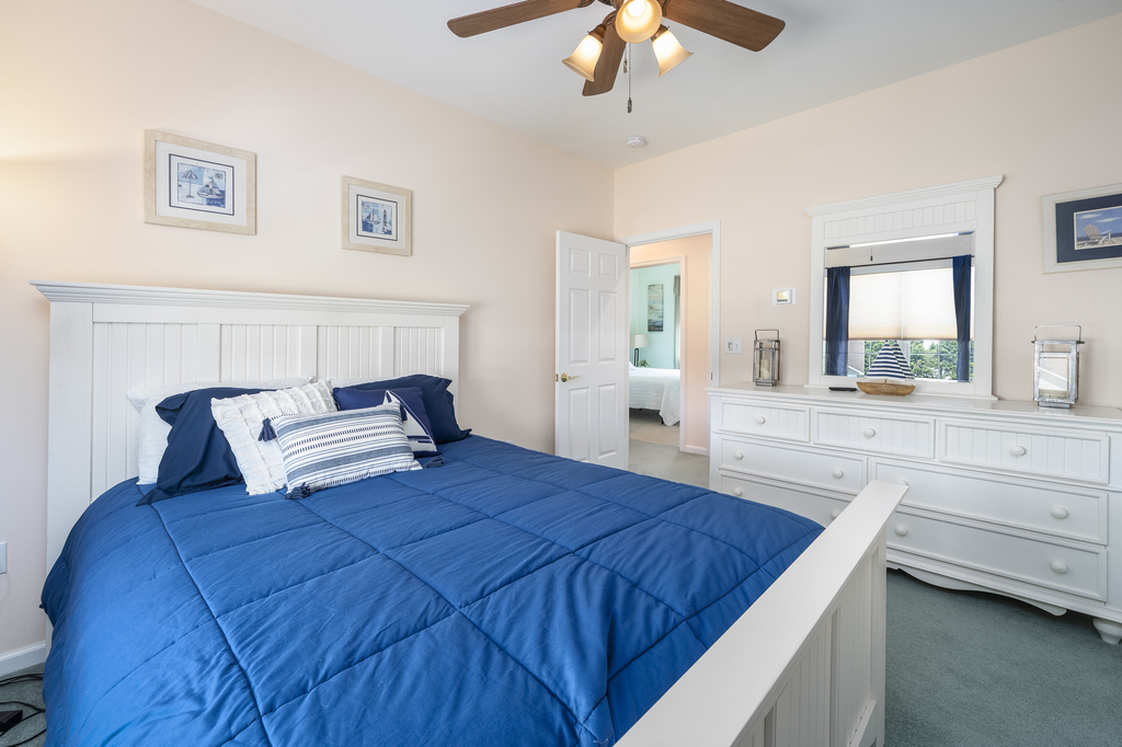 Bedroom 3 has a Queen Bed and is decked out in Nautical Navy.