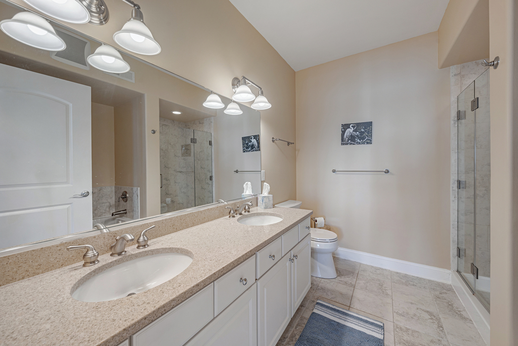 Primary Full Bath with spa-like Soaking Tub, Walk-in Shower, and Double Vanity.