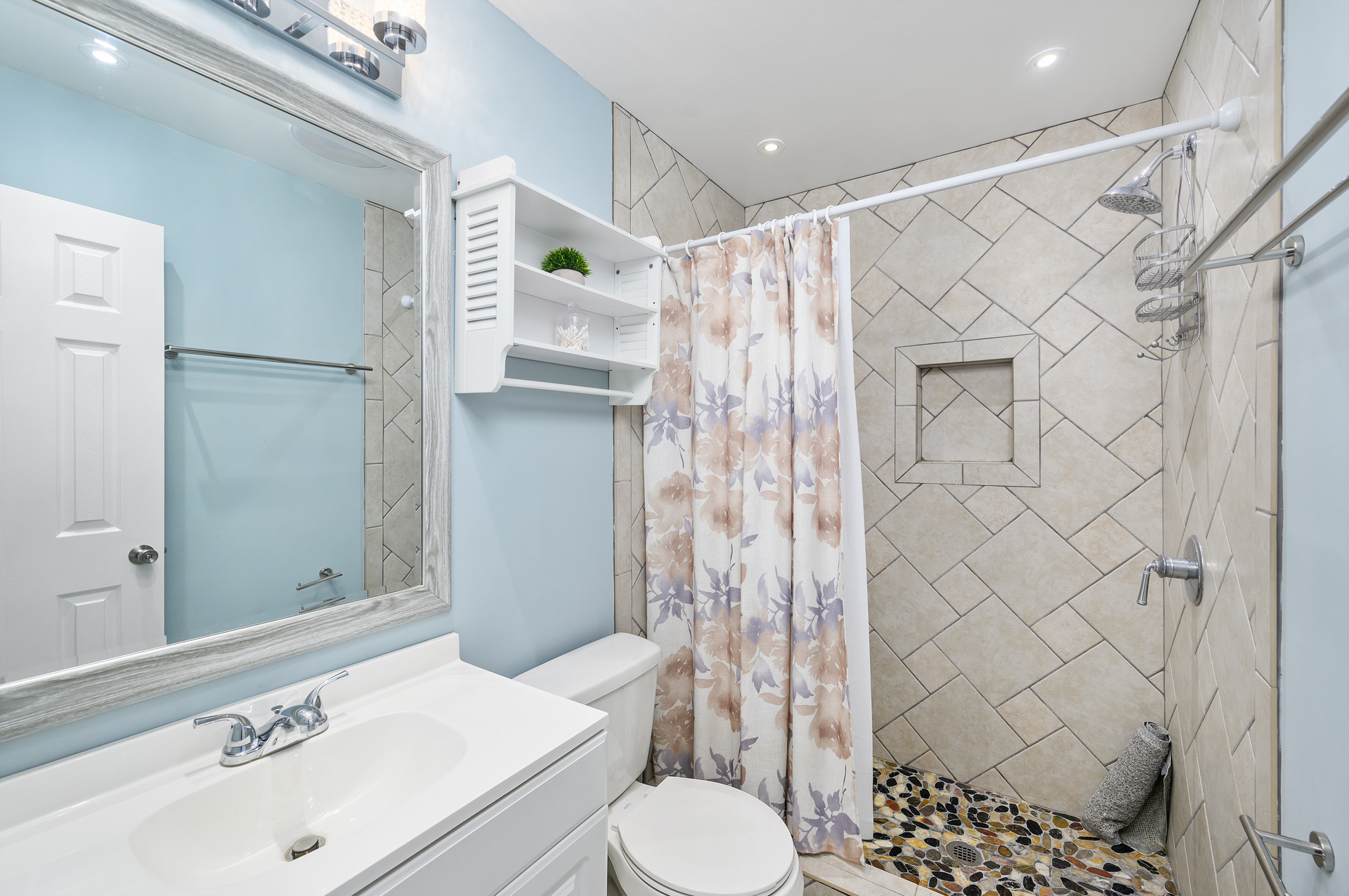 Upstairs full bath with custom tile walk-in shower.