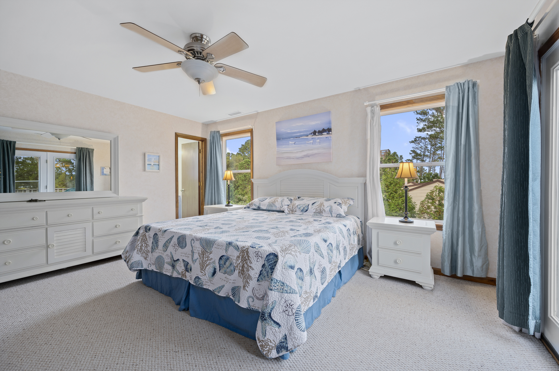 Bedroom 4 has a King Bed and Private Water View Balcony.