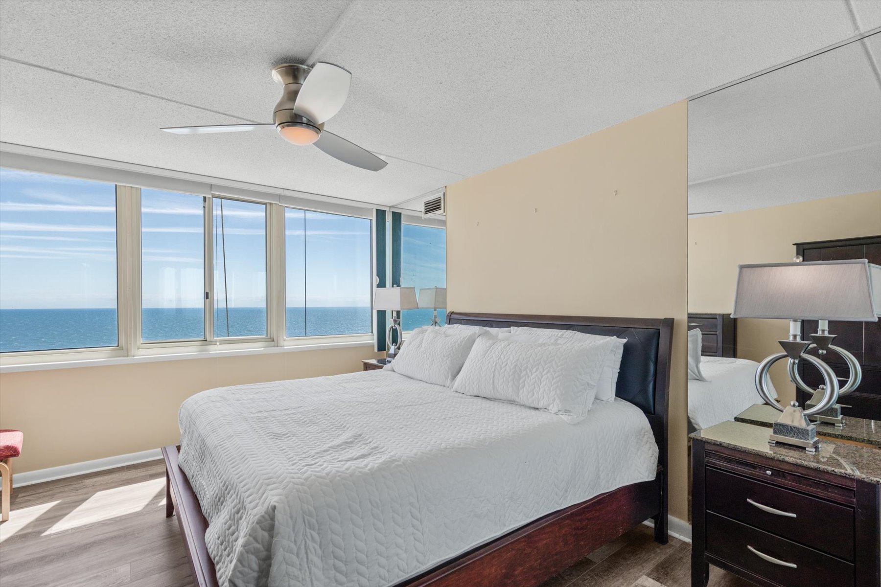 Wake up directly to the sights of the sea in this stunning oceanfront bedroom.