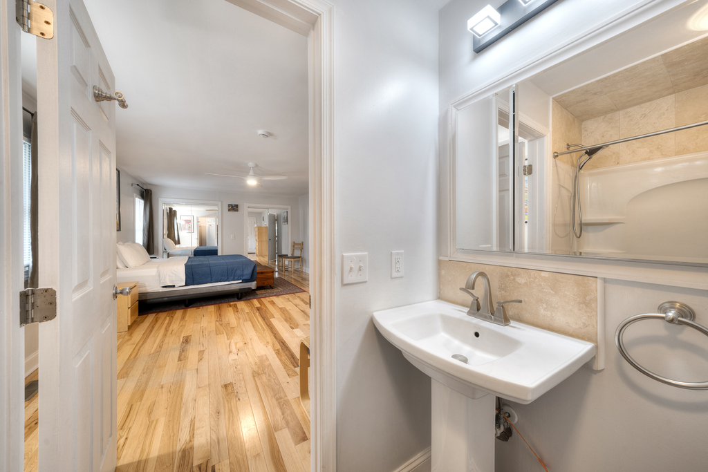 Attached Full Bath in Primary Bedroom.