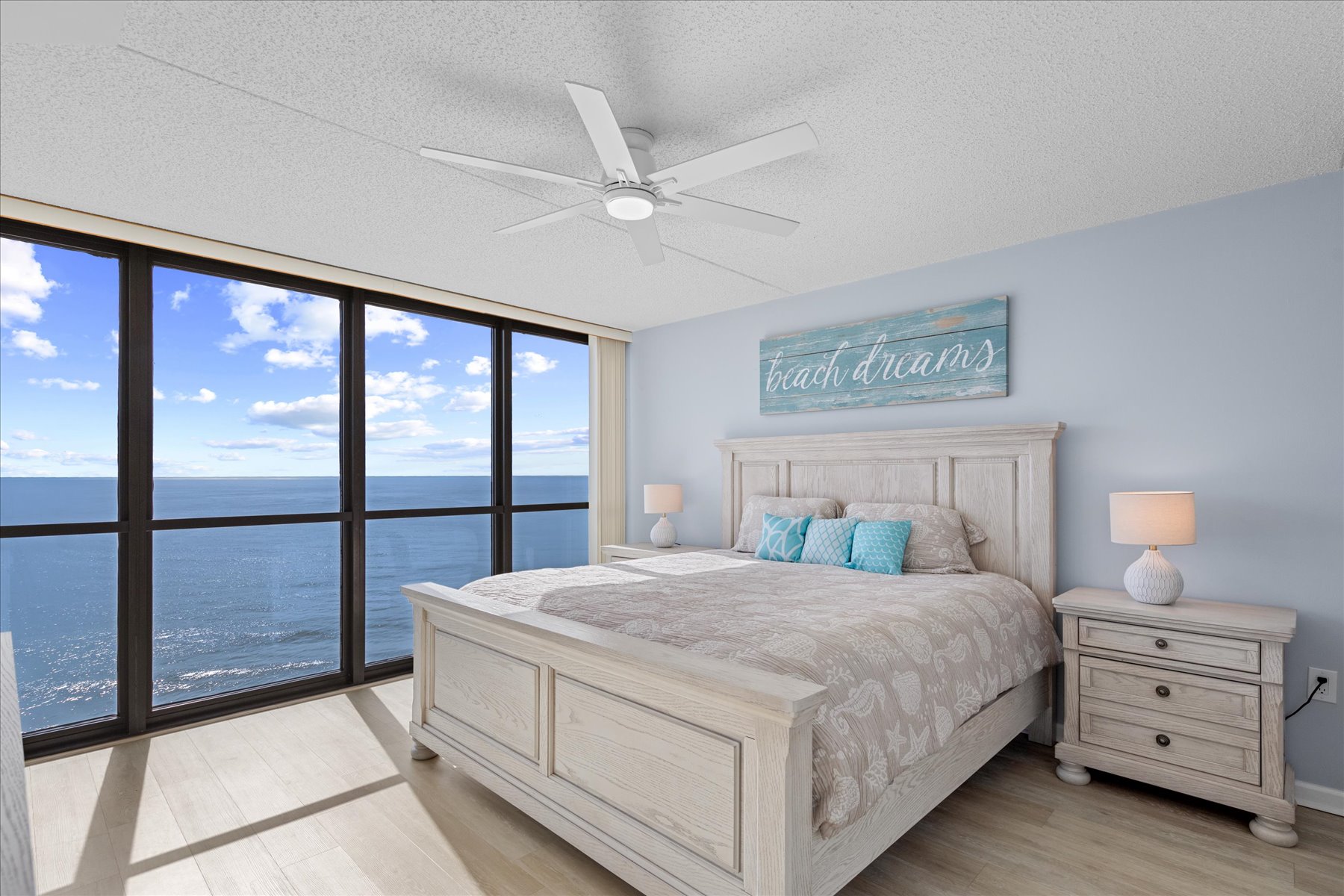 The Primary Bedroom is home to a King bed and floor to ceiling Ocean Views