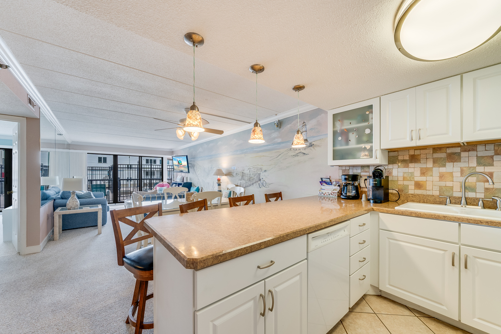 Bright, White & Open, this Kitchen is sure to be a Chef's Dream!