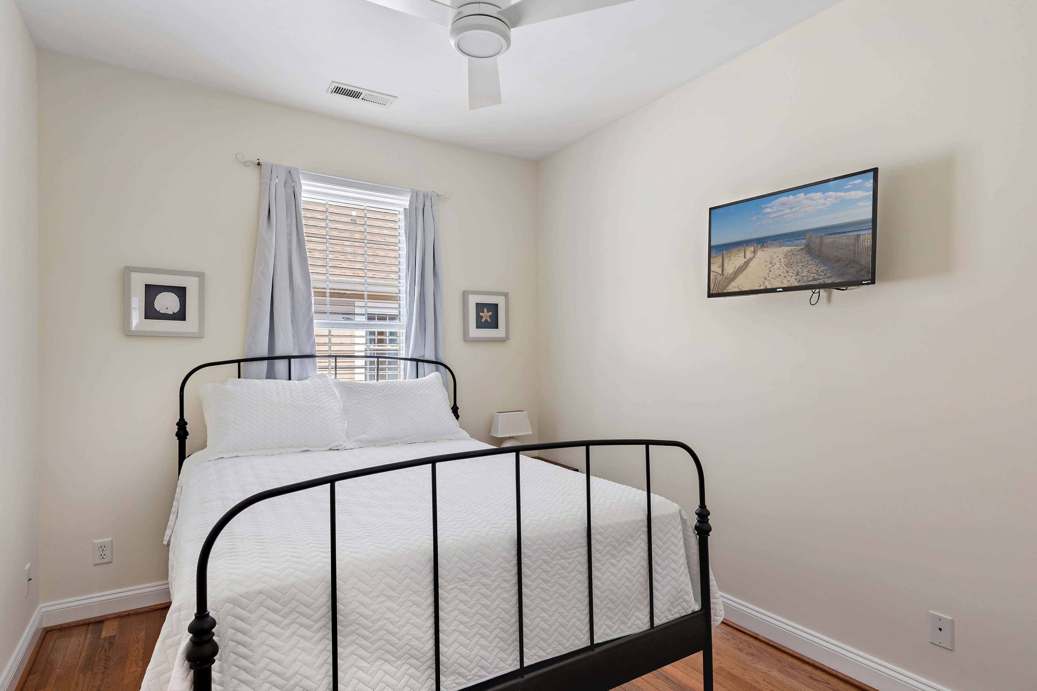 Down the hall, Bedroom 2 has a Queen Bed & Flat Screen TV!