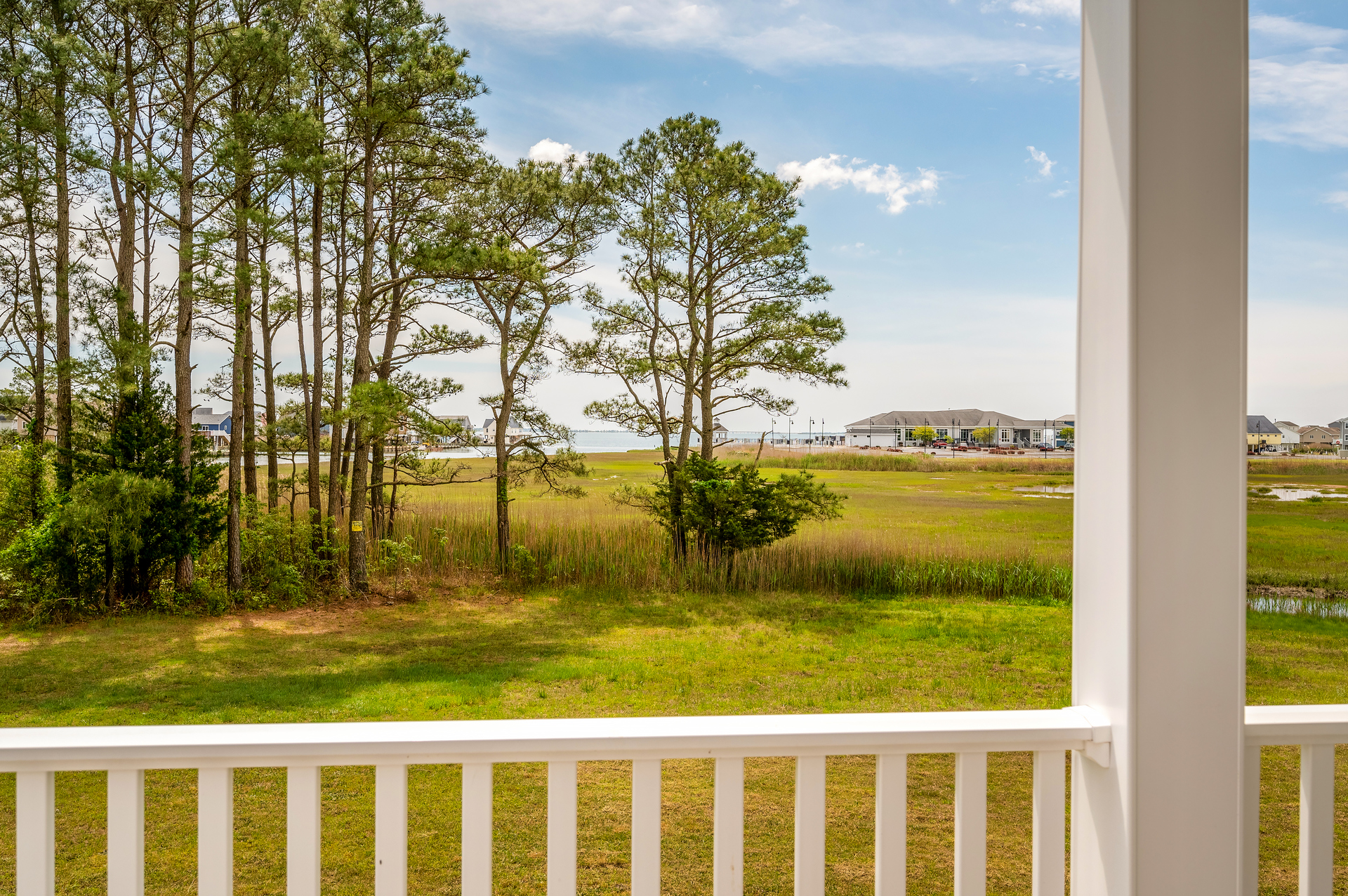 The Baywatch Bungalow overlooks the Marsh, Bay, and Marina Club in the distance.