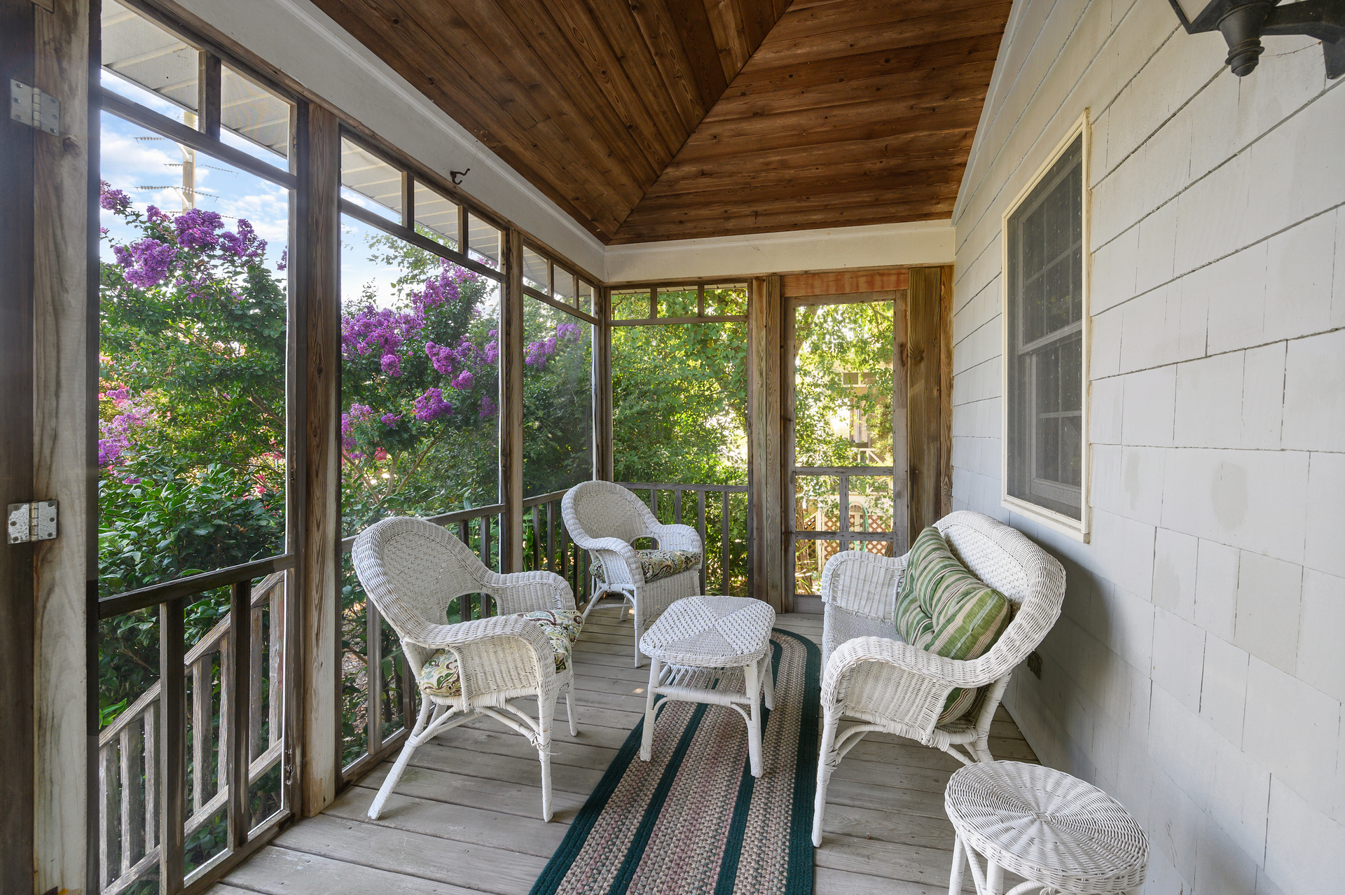 A cozy Screened Porch lines the front of Sea Glass.