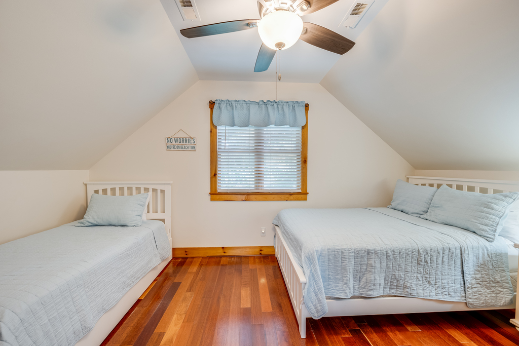 Upstairs, Bedroom 2 is dressed in beachy blues, and has a Full Bed and a Twin Bed.