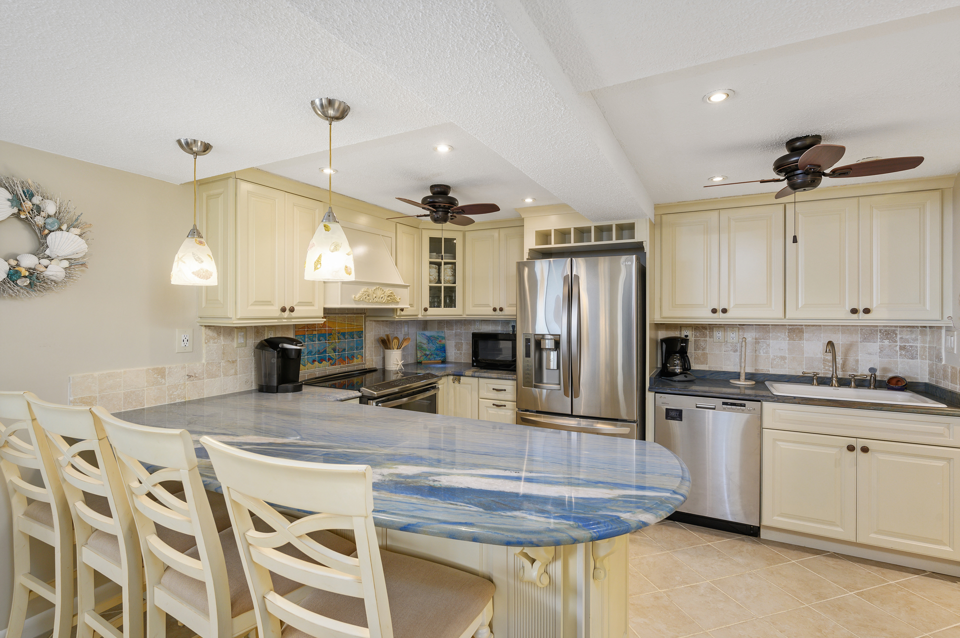 The Chef in your family is sure to adore this beautifully renovated kitchen with custom tile and countertops