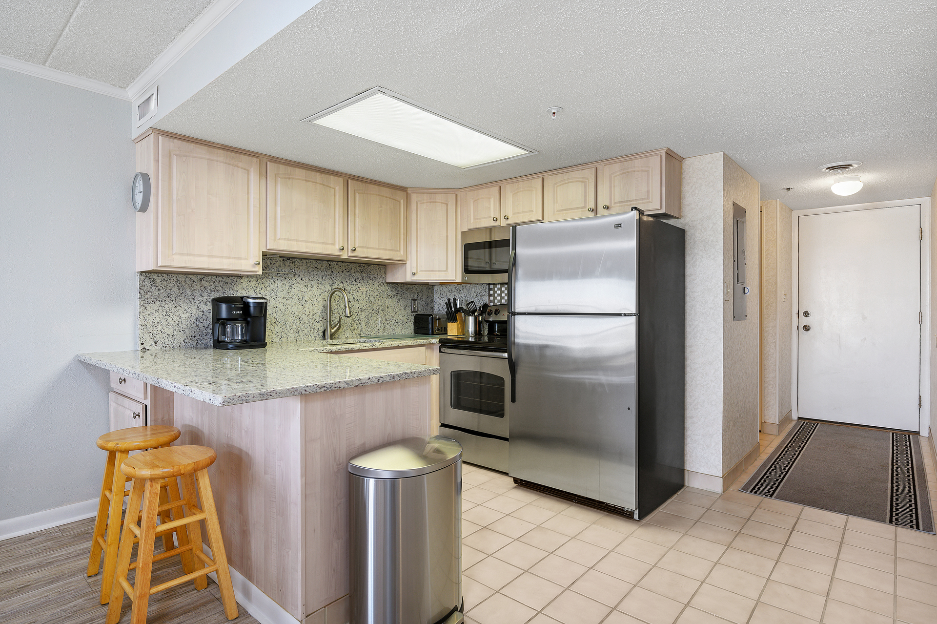 The open kitchen provides plenty of counter space to prep your cooler for the beach!