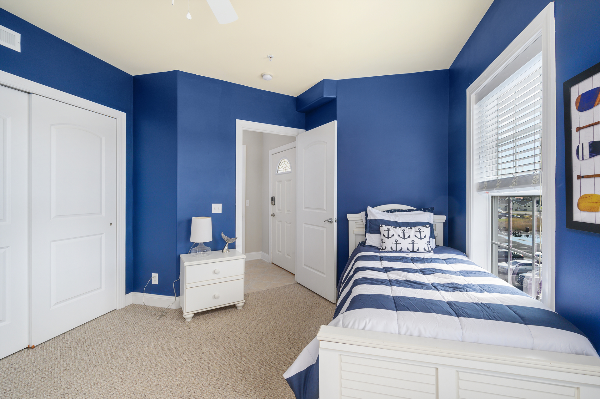 Decorated in Nautical Navy and Crisp White.