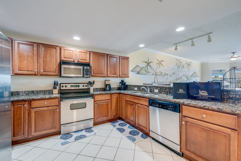 Gourmet Kitchen with Granite, Custom Tile, & Stainless Steel Appliances.