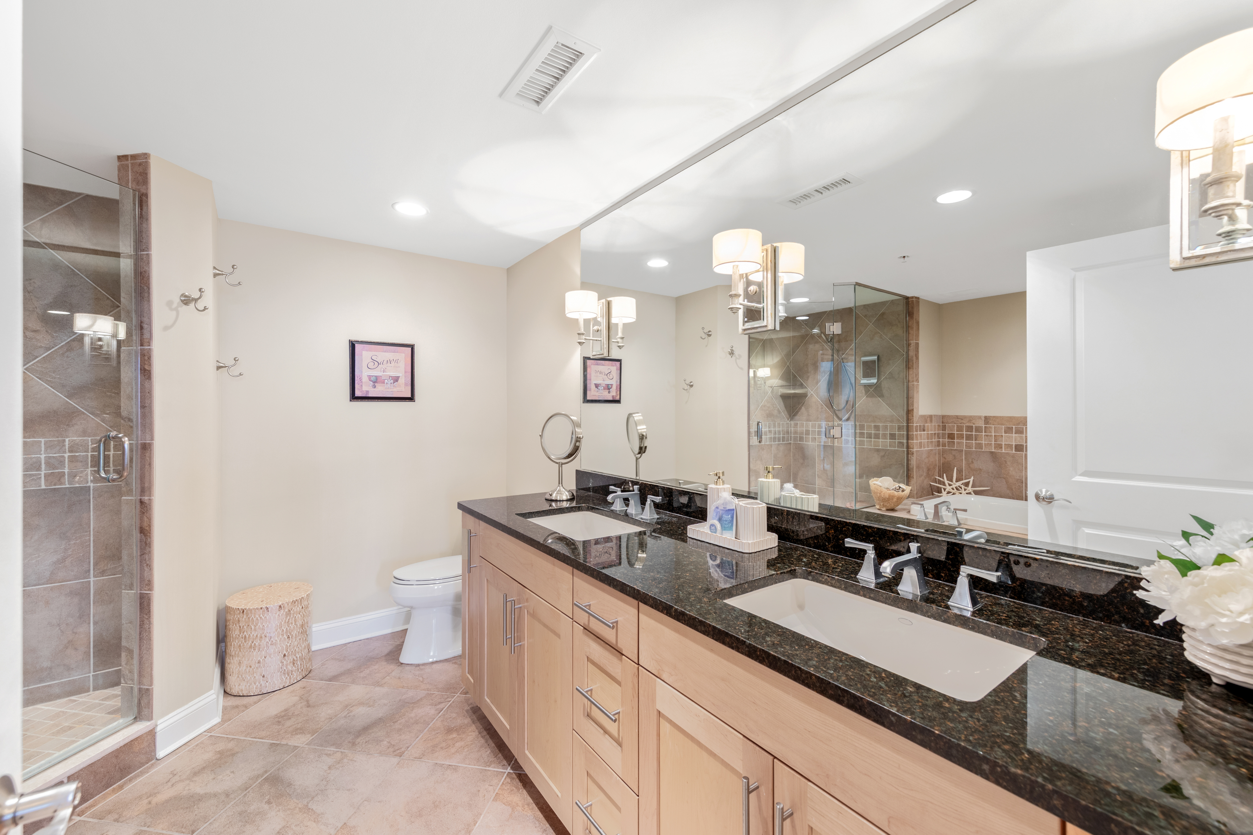 Gleaming Granite and Double Vanity in the Primary Bath.