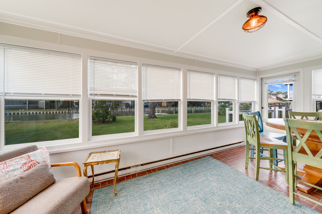 A wall of windows to the Water lets in lovely Canal and Bay Views.
