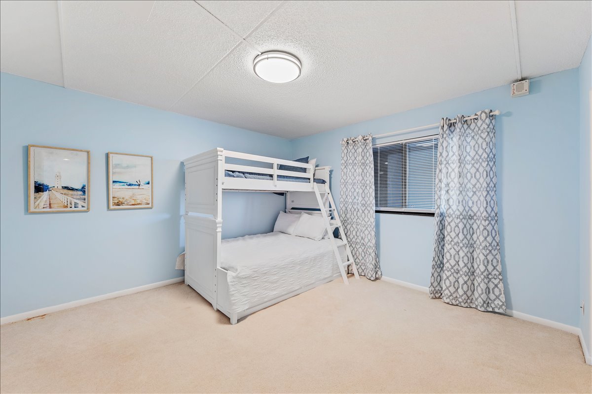 Bedroom 2 is adorned in Light & Beachy Blues.