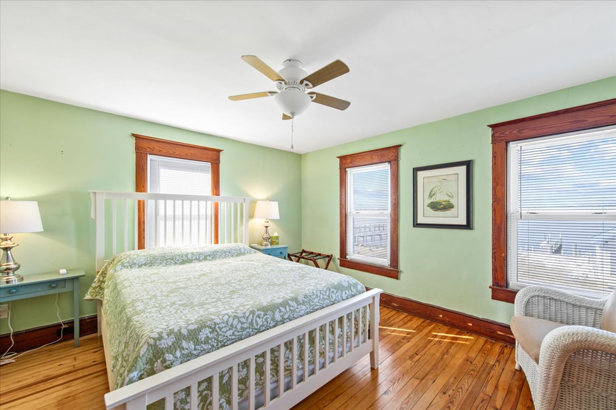 Bedroom 3 is adorned in Sea Grass Greens and has another Queen Bed.