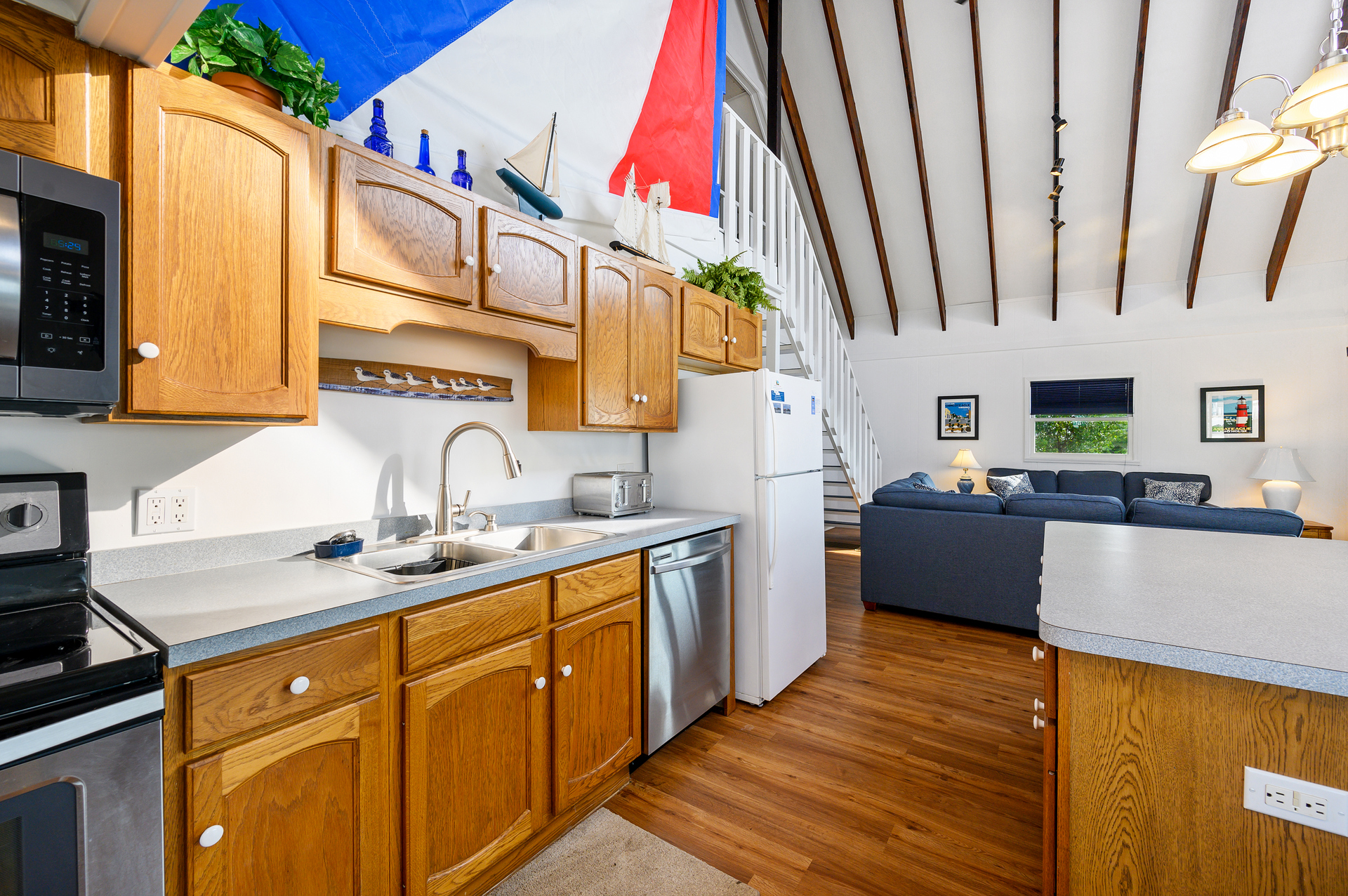 Open Layout with Soaring Ceilings and New Flooring.