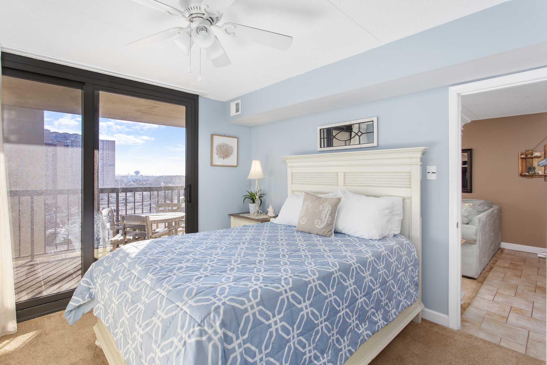 The Primary Bedroom is located just off the Living Area with a Plush Queen Bed.